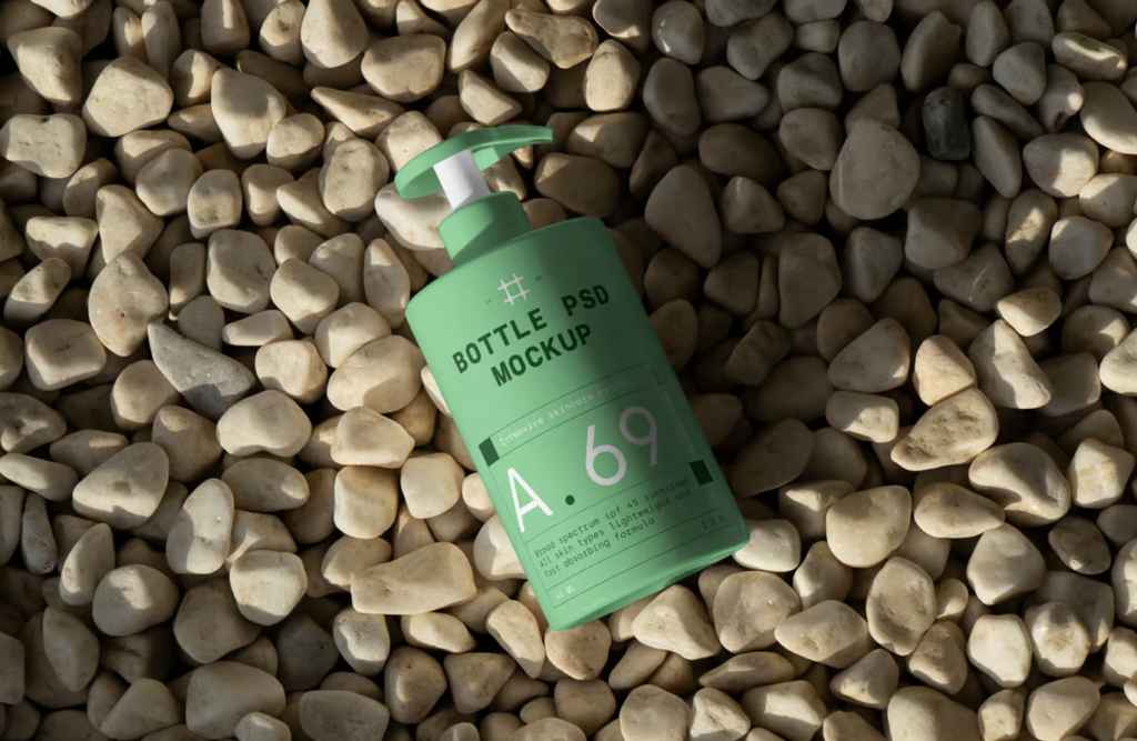 Cosmetic Bottle on the Beach PSD Mockup Showcase Your Designs in a Stunning Lifestyle Setting 