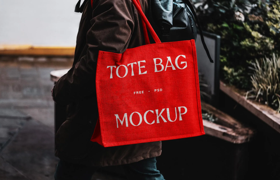 Eco Bag Carrying by Man Mockup PSD Presentation