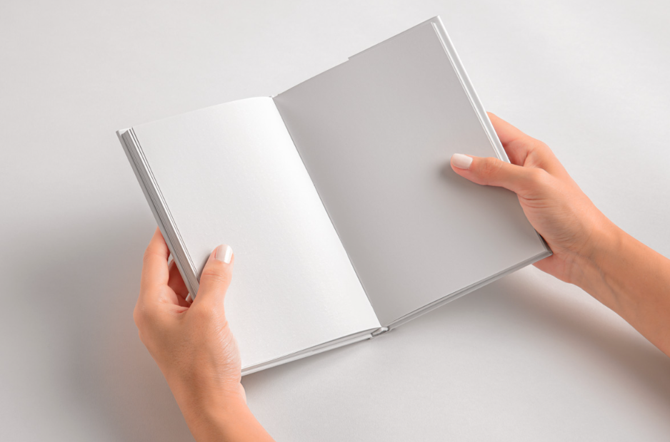Hands Holding Open Hard cover Book PSD Mockup
