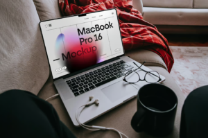 MacBook Pro Laying on Couch PSD Mockup