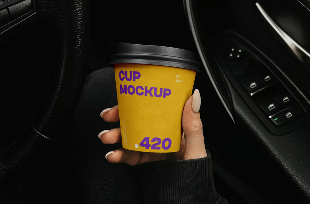 Paper coffee cup in the car Mockup